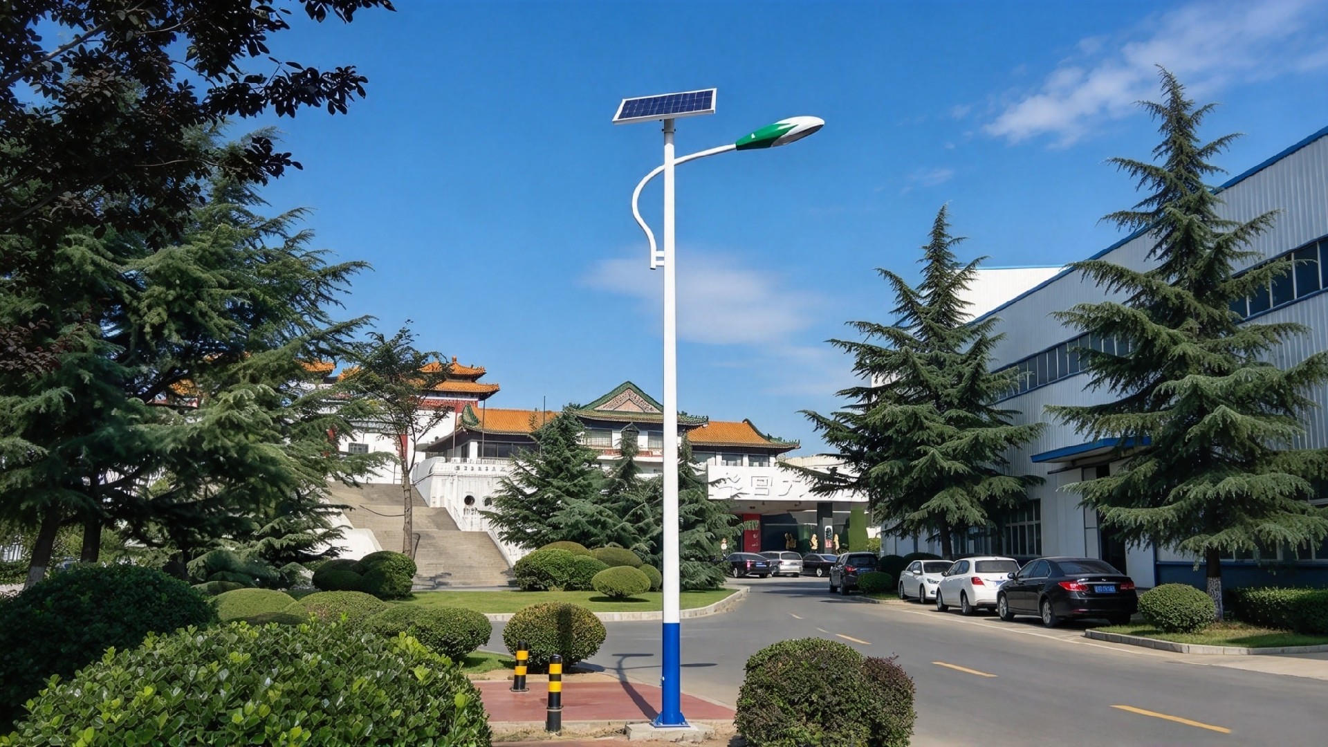 Solar street light pole along a road near buildings